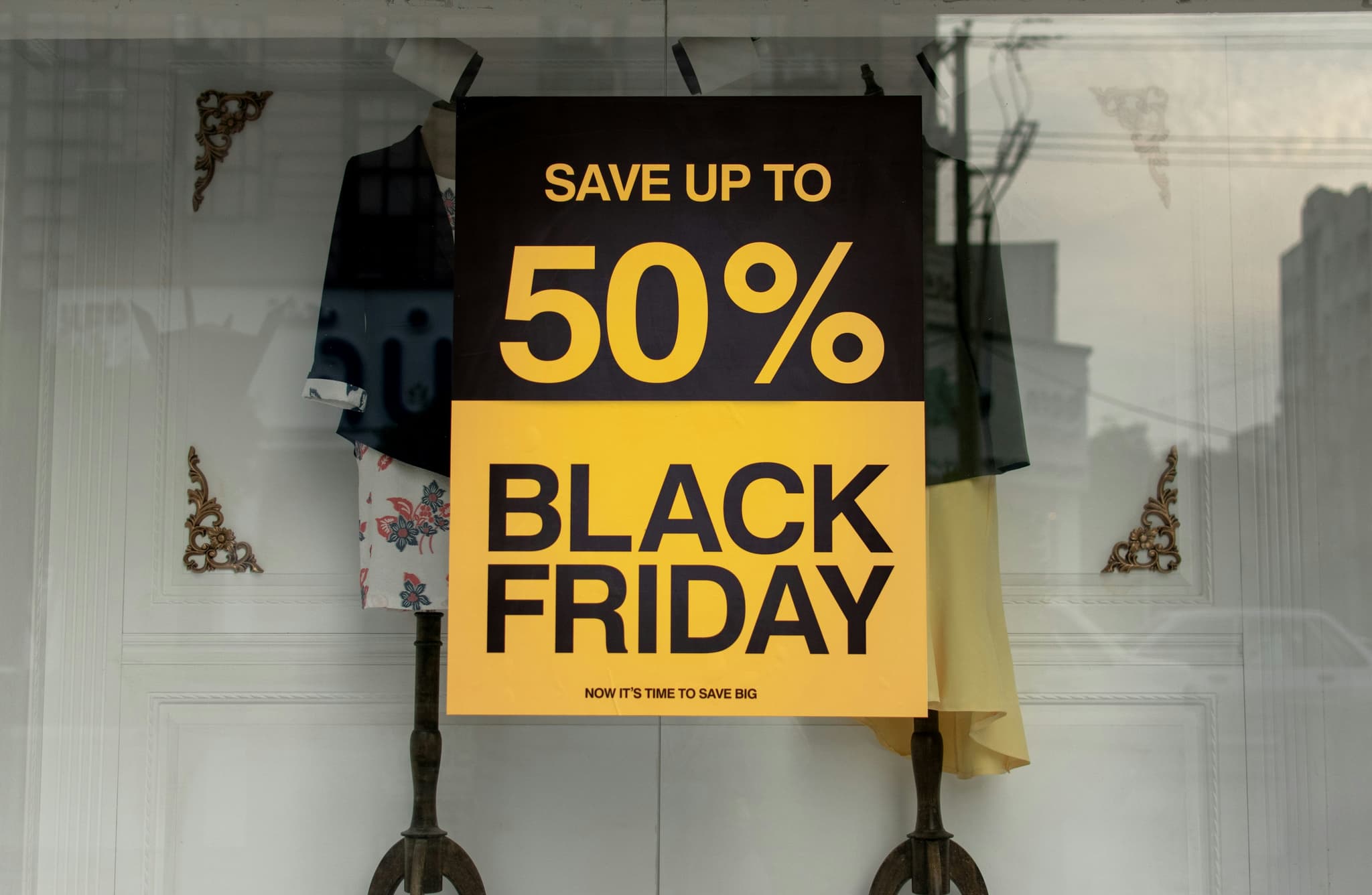 Black Friday sale sign in a shop window — Black Friday & Cyber Monday 2026 dropshipping game plan